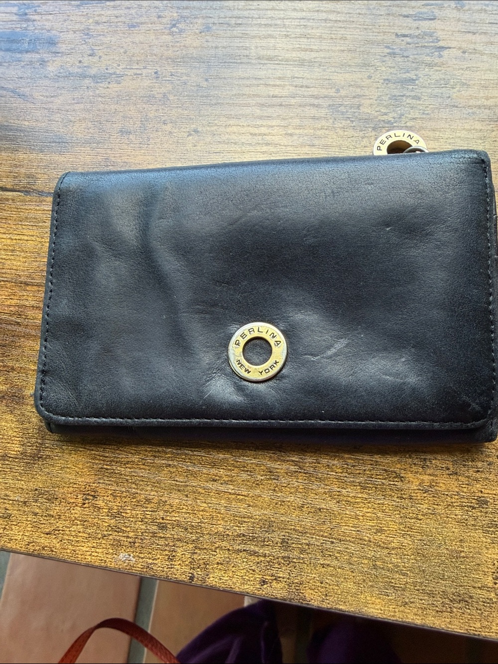 Perlina Black Leather Compact Wallet with Gold Logo Accent